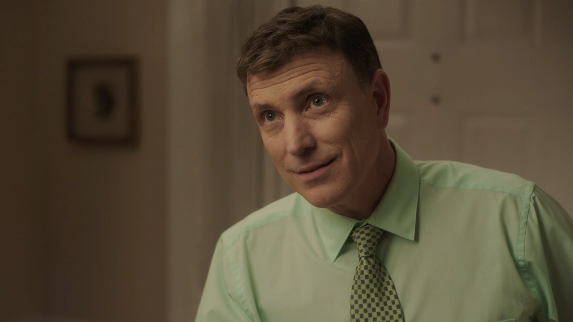 Richard Dobbs leans forward with a questioning expression