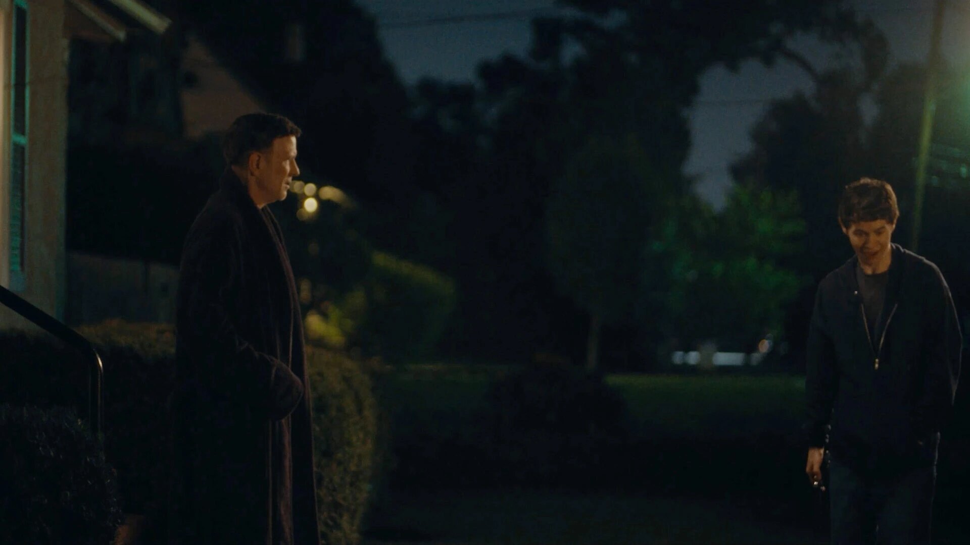 Mr. Greene and Will speak outside at night