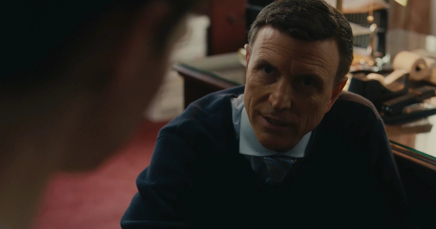 Mr. Greene speaks with Will in an office