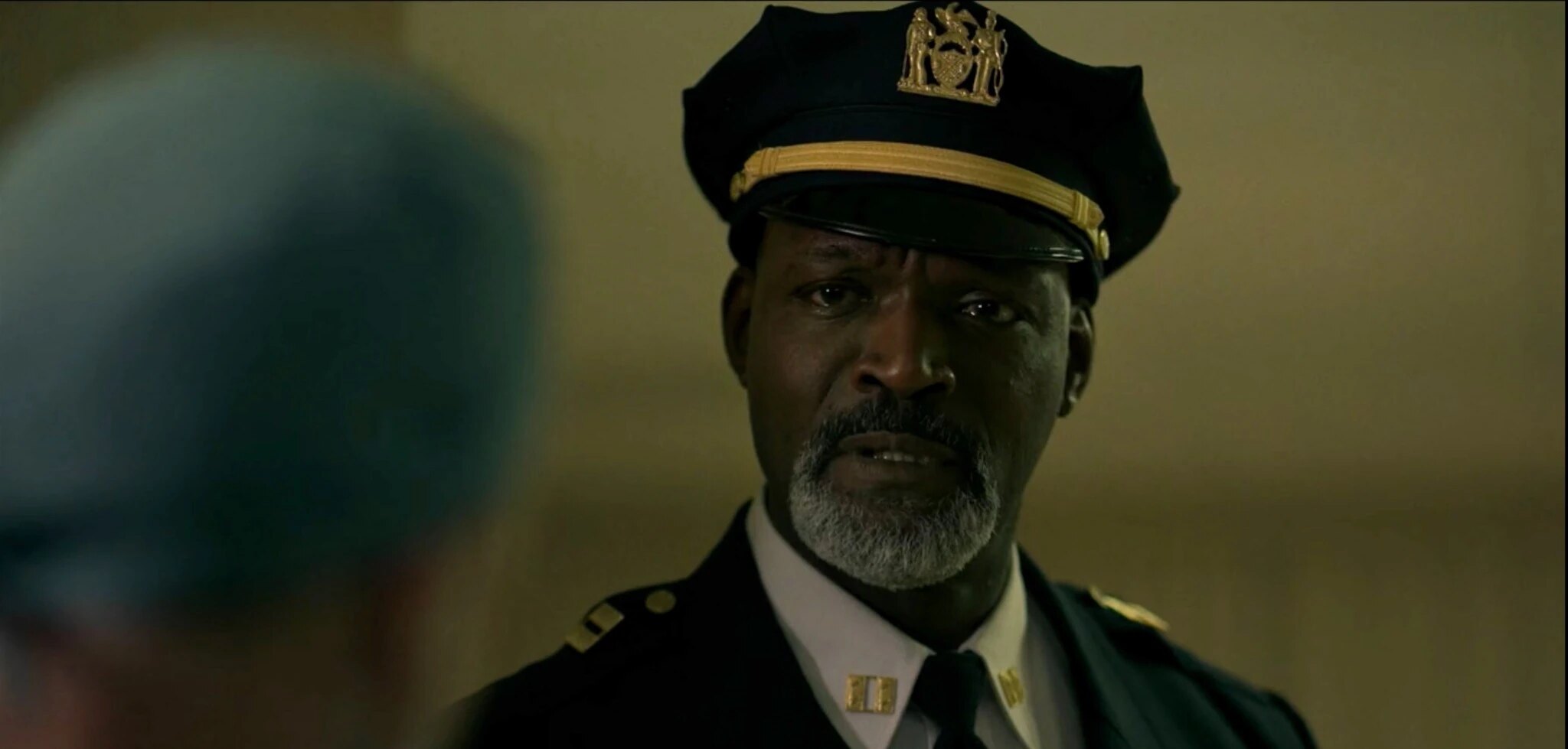 Captain Louis Baptiste listens to the Surgeon