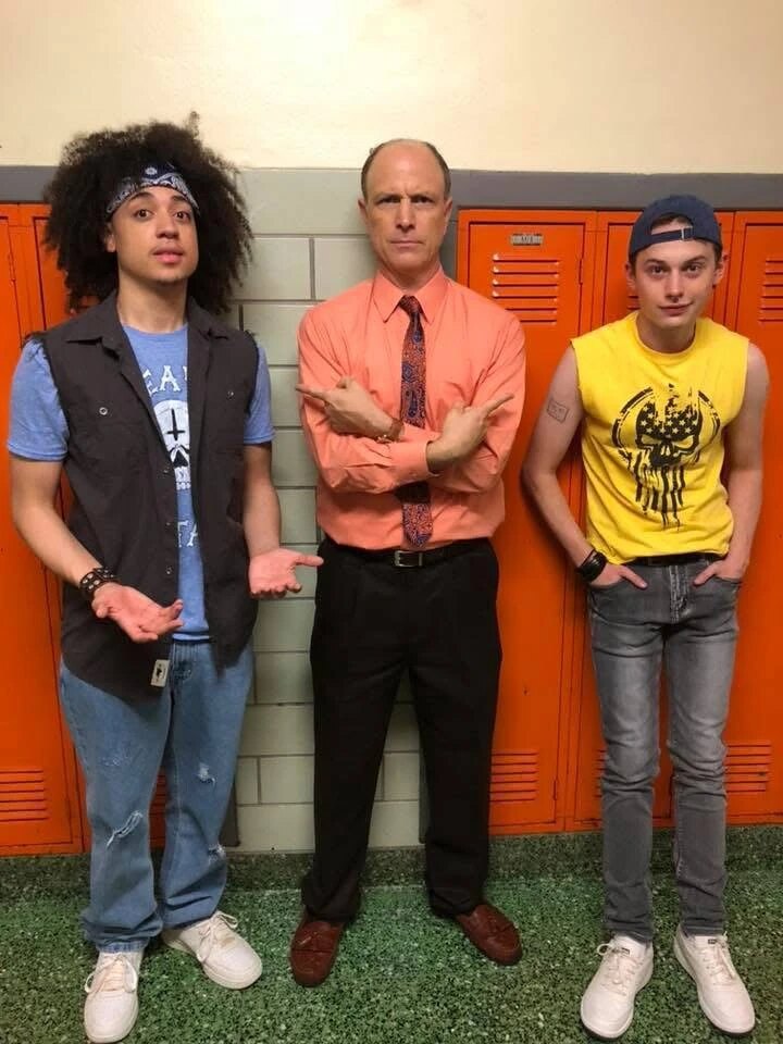 Francisco Burgos, Drew Moore, and Uly Schlesinger pose by the school lockers