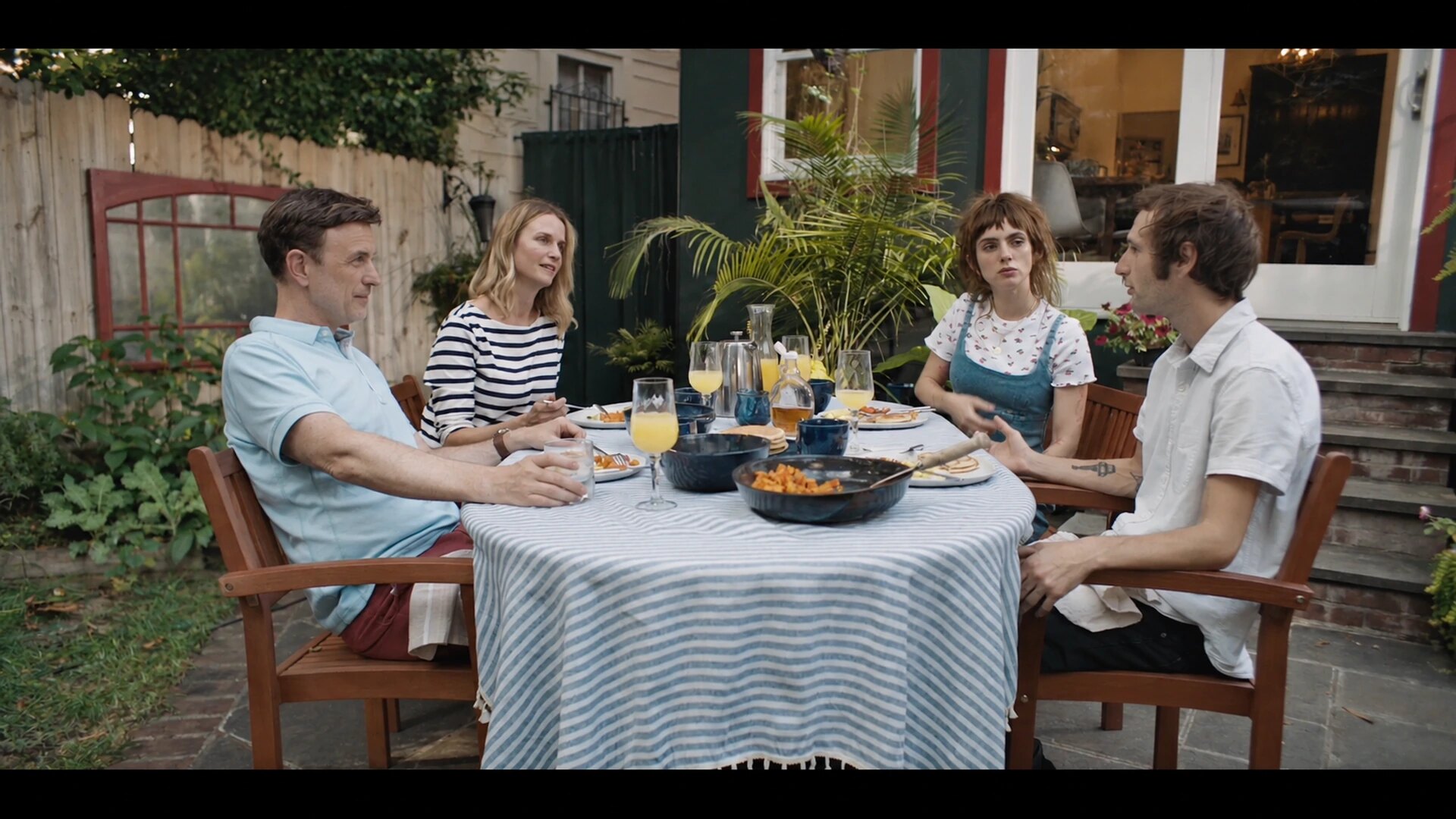 Mark and Nancy meet Jane and Frankie at the garden table