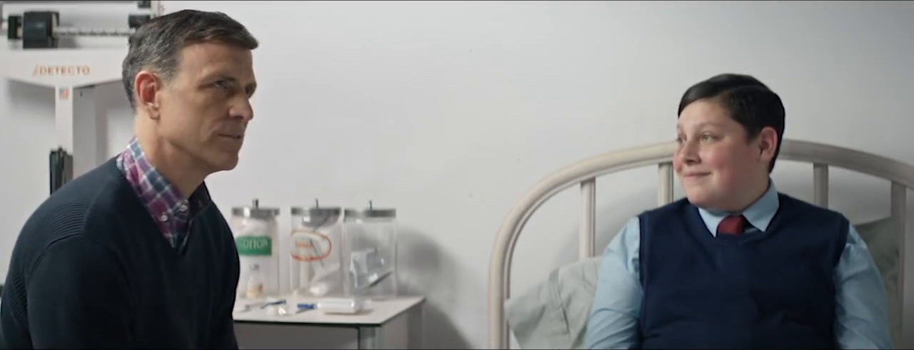 Drew Moore as Arthur and David Rosenthal as Buckley beside the hospital bed