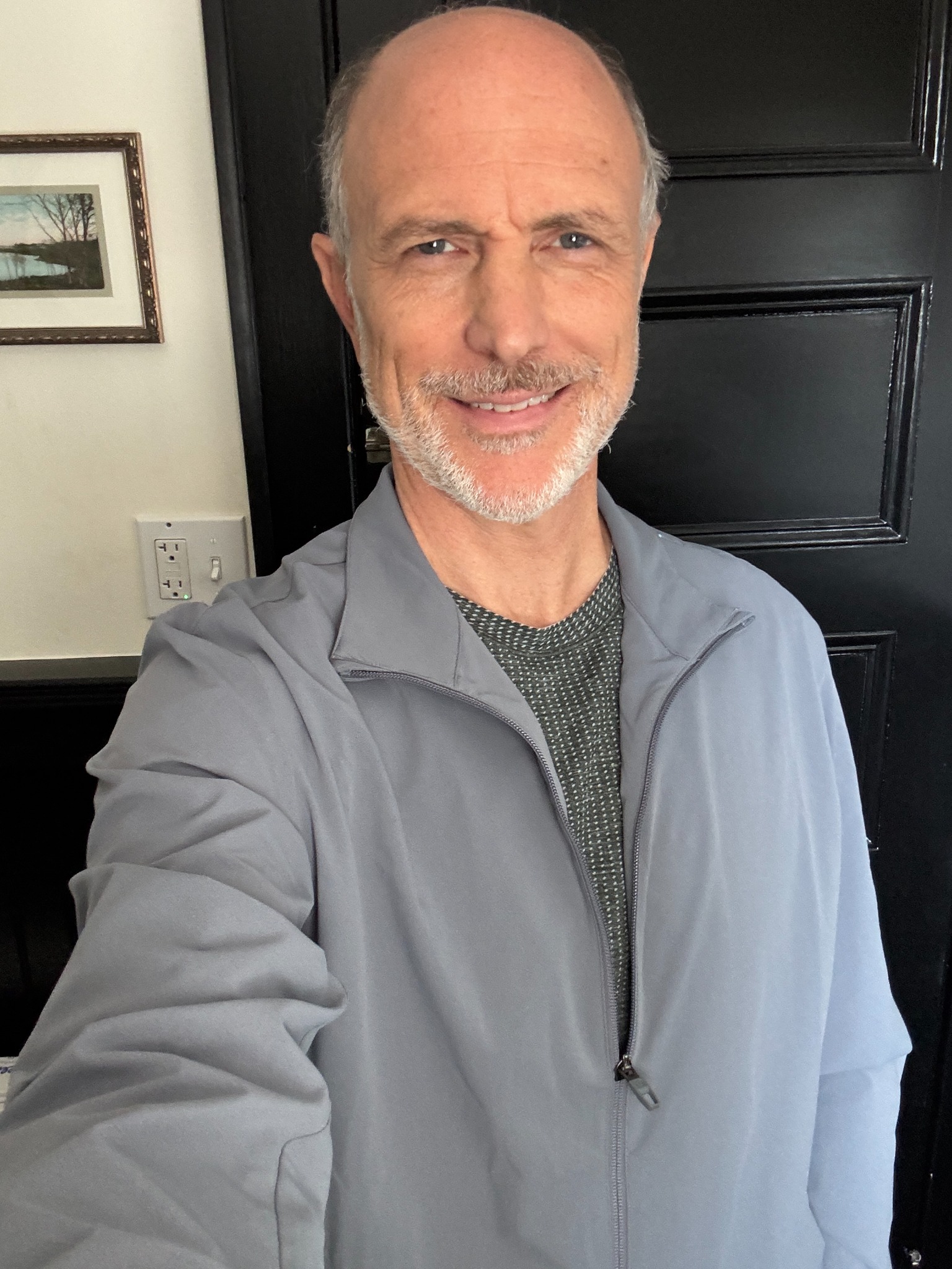 Drew Moore in a gray jacket in an on-set selfie as Bosley